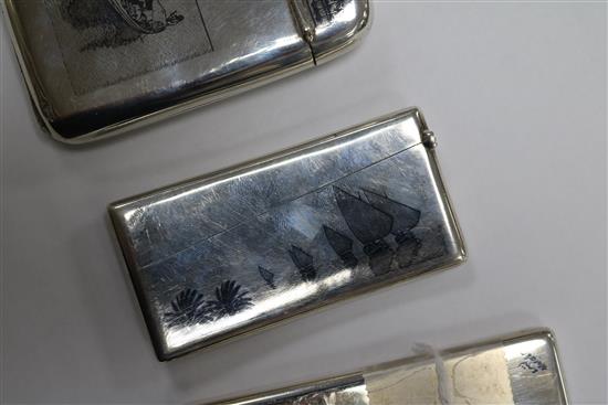 Two continental white metal and niello card cases and a similar cigarette case.